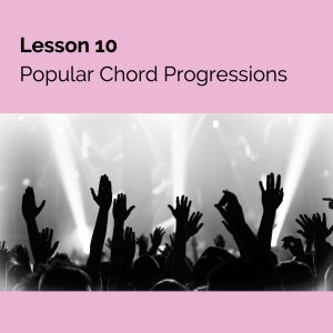 A crowd with their hands in the air watching a band.